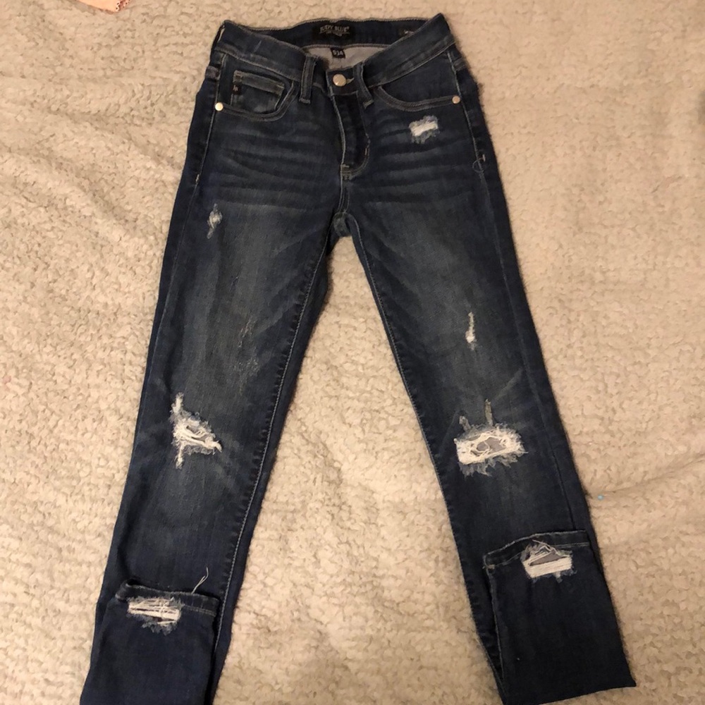Destroyed blue jeans by Judy Blue